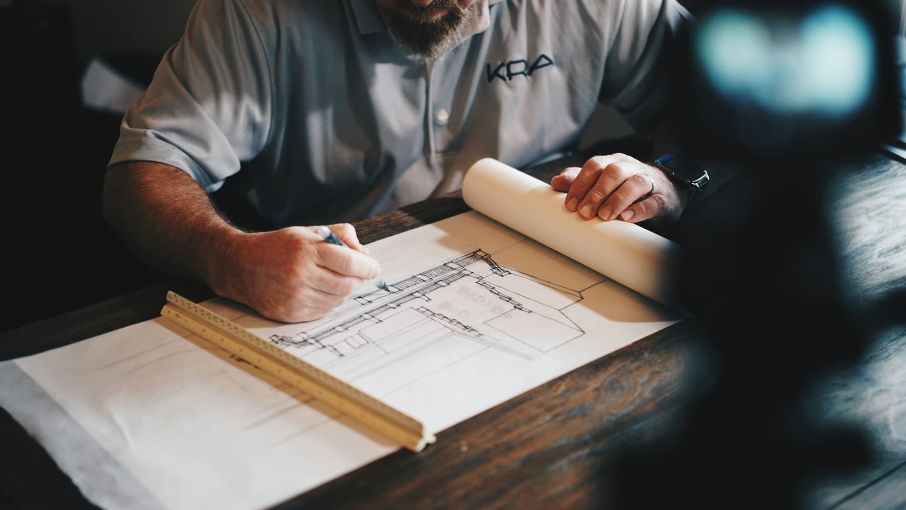 Construction professionals reviewing plans together on site